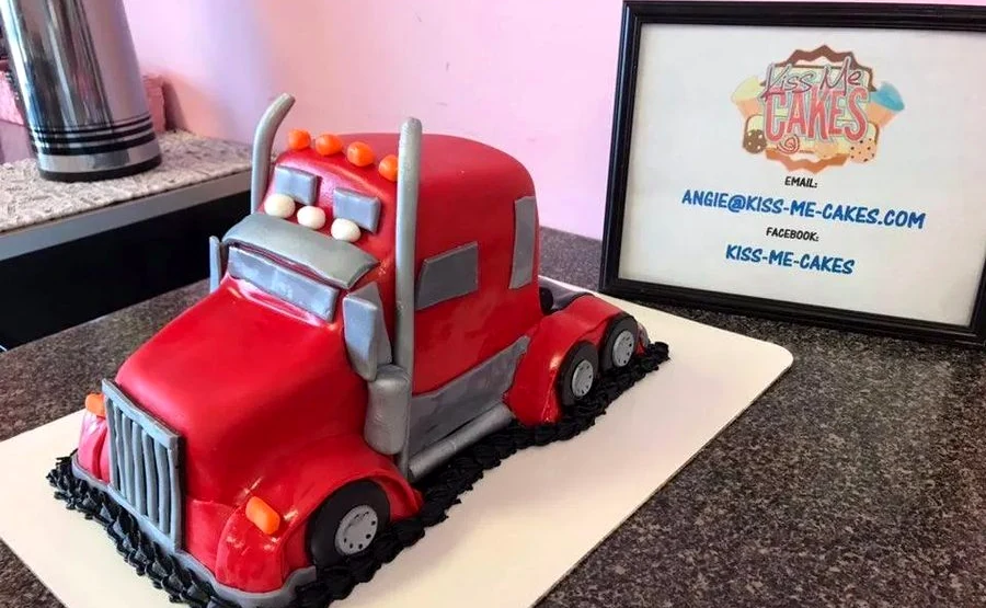Custom red truck cake made by Kiss Me Cakes